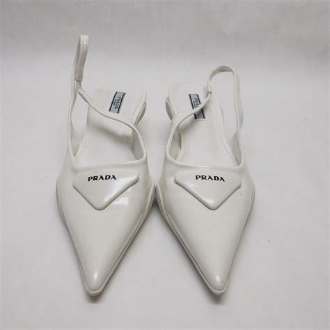 white prada kitten heels.